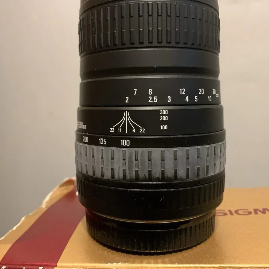 Объектив Sigma 100-300mm f4.5-6.7 DL Telephoto Zoom Lens — фото лота 1