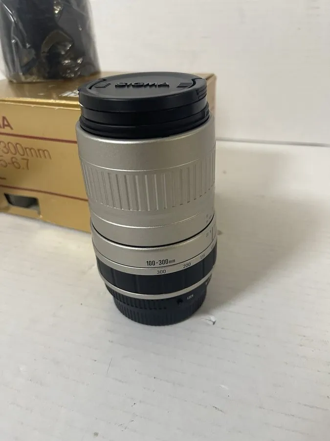 Объектив Sigma 100-300mm f4.5-6.7 DL Telephoto Zoom Lens